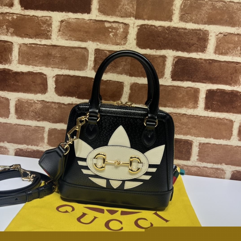G*u*i top handle bags